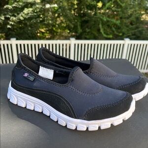 Black and White Slip-On Sneakers by Skechers Sport